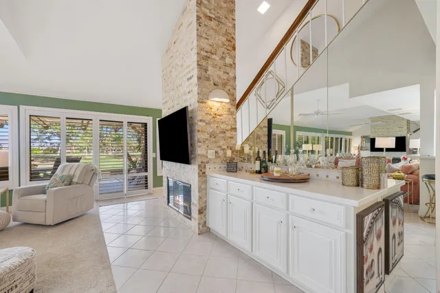 a kitchen with sink and mirror
