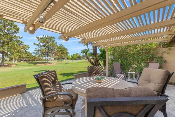 a view of a patio with swimming pool