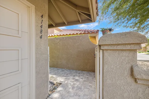 a bathroom with a granite countertop shower and a sink