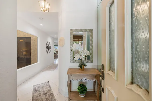 a view of an entryway with wooden floor