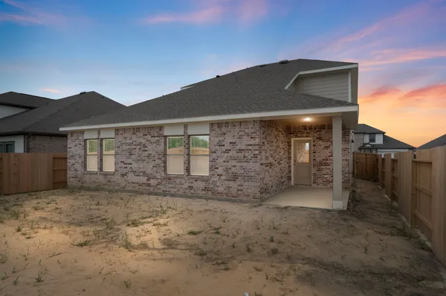a front view of a house with yard
