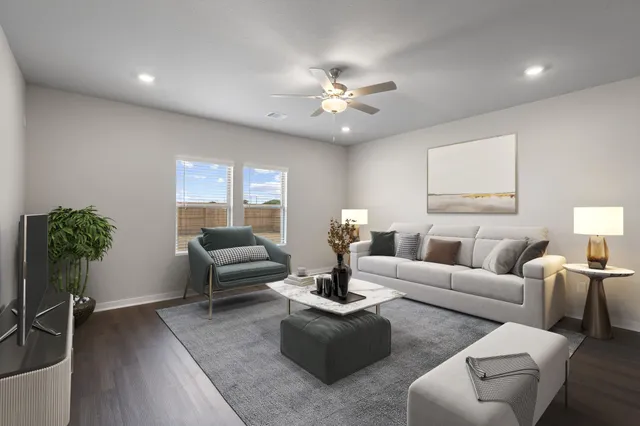 a living room with furniture a chandelier and a window
