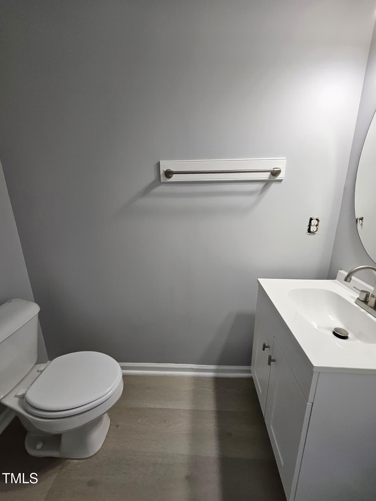 2205 Kirkhaven Road Morrisville, NC 27560 - Photo 11 of 36 a bathroom with a sink a toilet and vanity