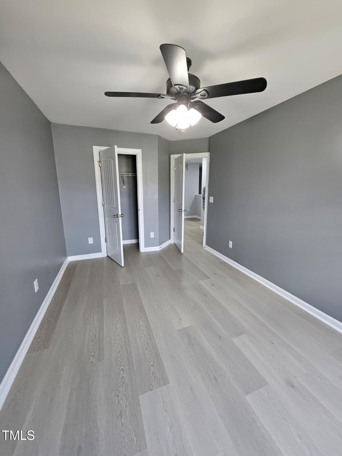 2205 Kirkhaven Road Morrisville, NC 27560 - Photo 17 of 36 a view of an empty room with window and chandelier fan