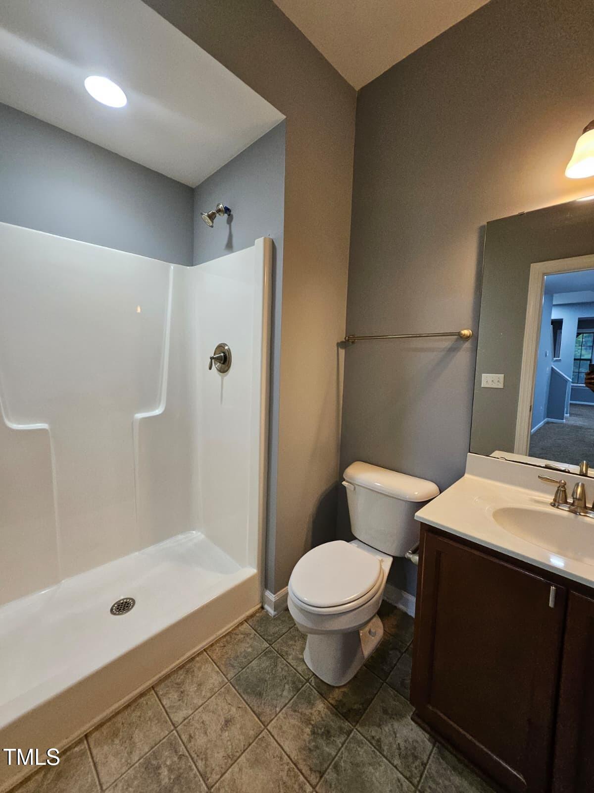 2205 Kirkhaven Road Morrisville, NC 27560 - Photo 24 of 36 a bathroom with a sink a toilet and shower