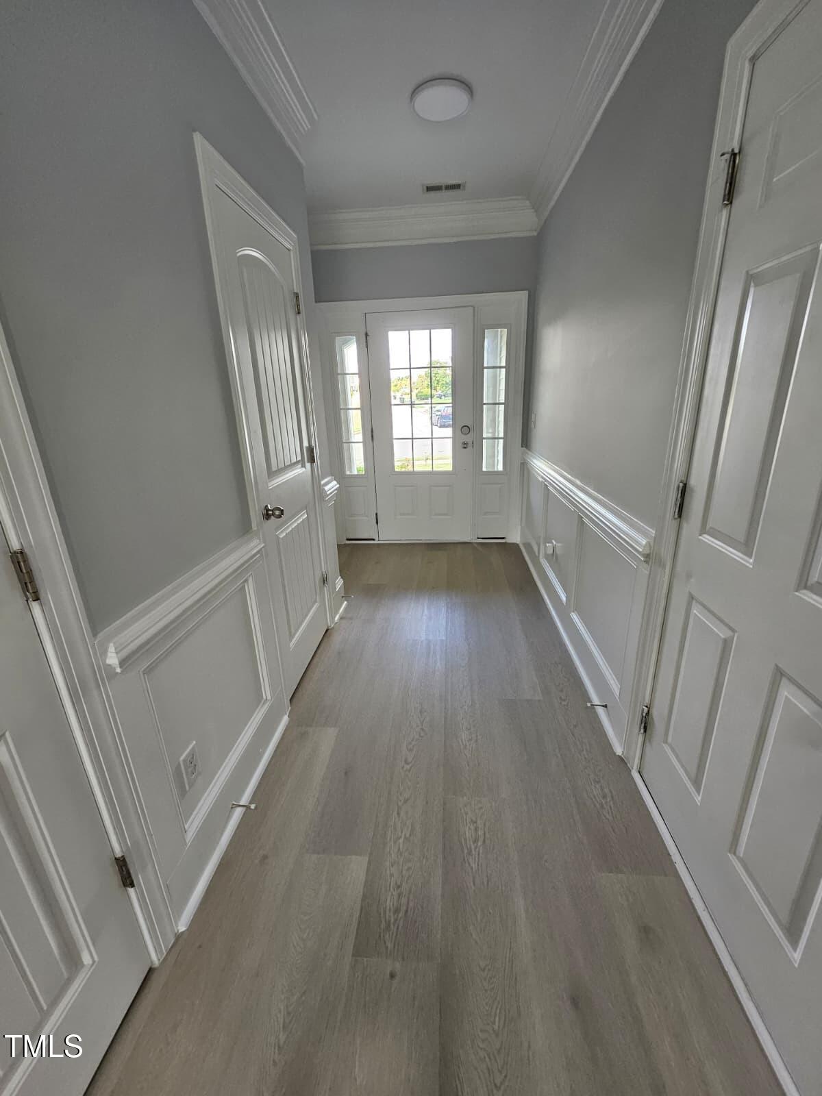 2205 Kirkhaven Road Morrisville, NC 27560 - Photo 3 of 36 a view of entryway with wooden floor