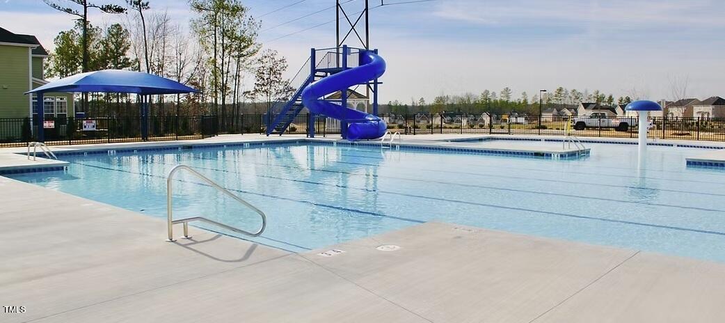 2205 Kirkhaven Road Morrisville, NC 27560 - Photo 34 of 36 a view of a swimming pool with a bench and lounge chair
