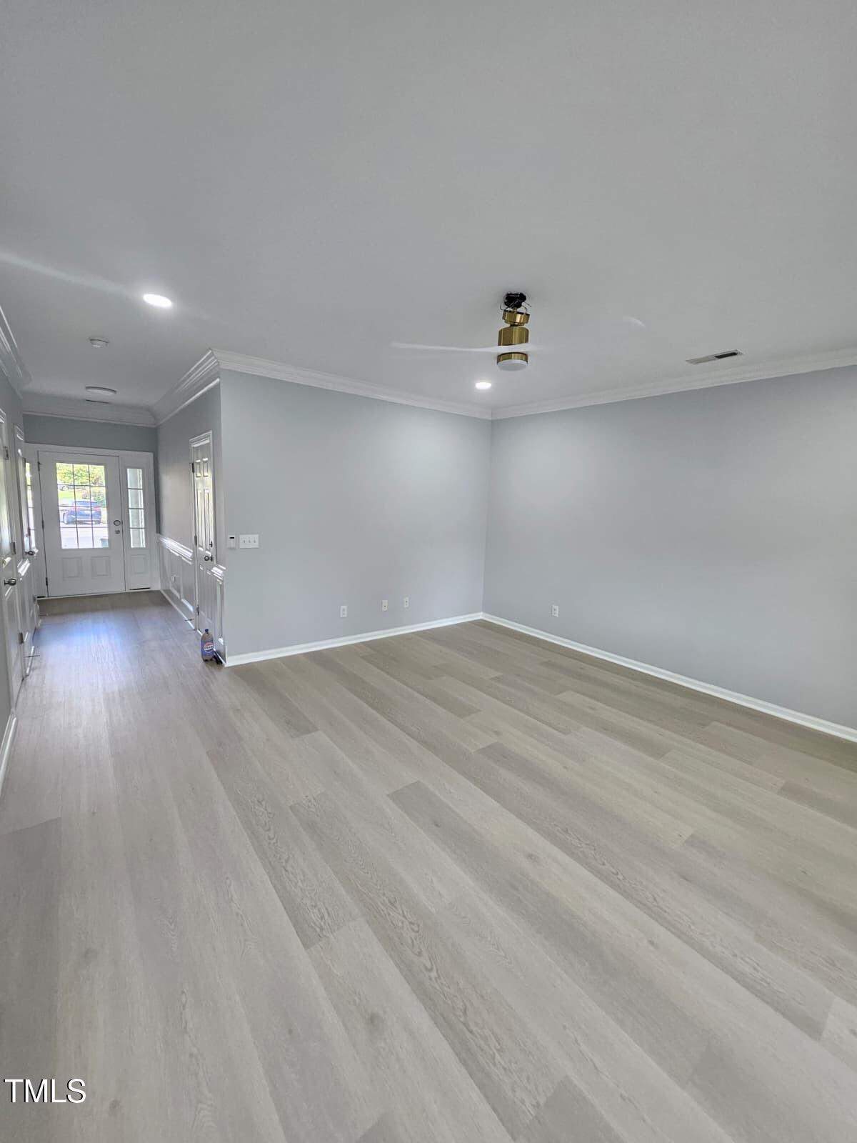 2205 Kirkhaven Road Morrisville, NC 27560 - Photo 4 of 36 wooden floor in an empty room with a window