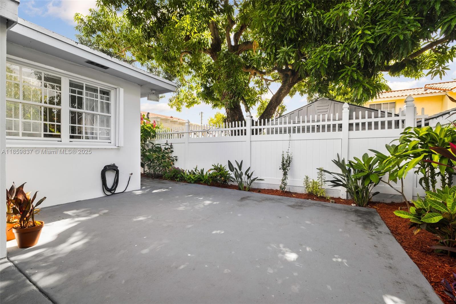 2928 Southwest 5th Street, Unit C Miami, FL 33135 - Photo 14 of 15 a front view of a house with garden