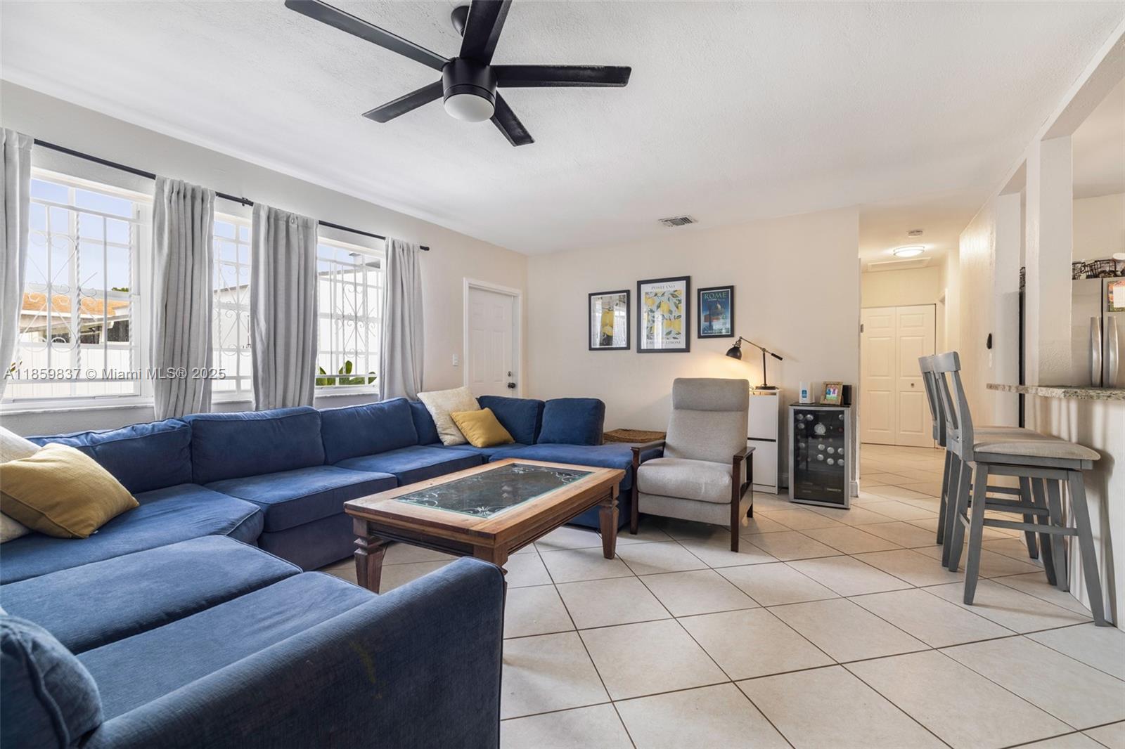 2928 Southwest 5th Street, Unit C Miami, FL 33135 - Photo 3 of 15 a living room with furniture and a window