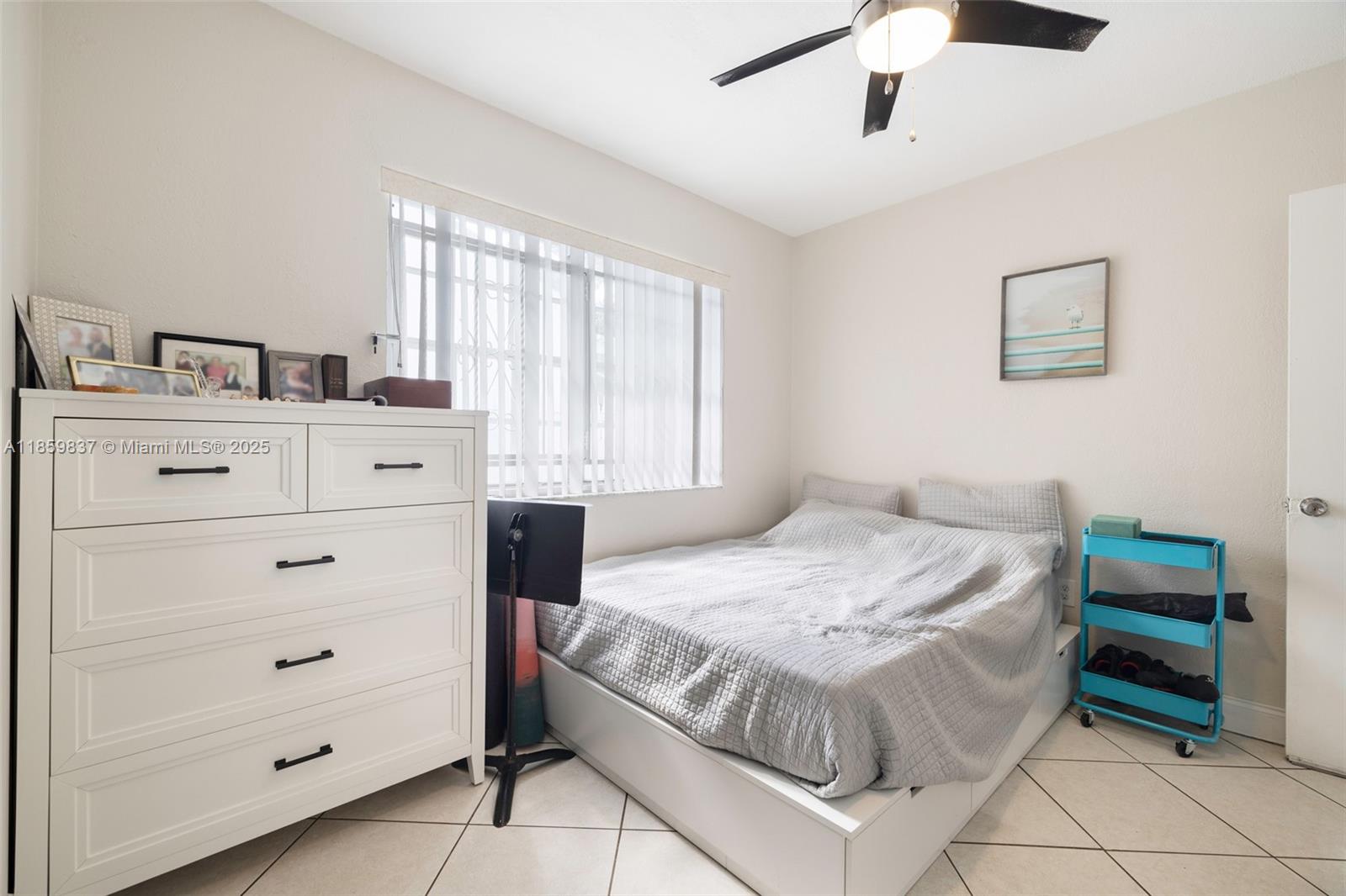 2928 Southwest 5th Street, Unit C Miami, FL 33135 - Photo 7 of 15 a bedroom with a bed and a dresser