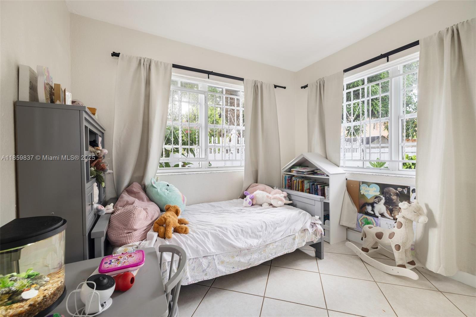 2928 Southwest 5th Street, Unit C Miami, FL 33135 - Photo 8 of 15 a bedroom with a bed and a window