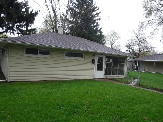 1131 146th Street Dolton, IL 60419 - Photo 1 of 15 a backyard of a house with lots of green space