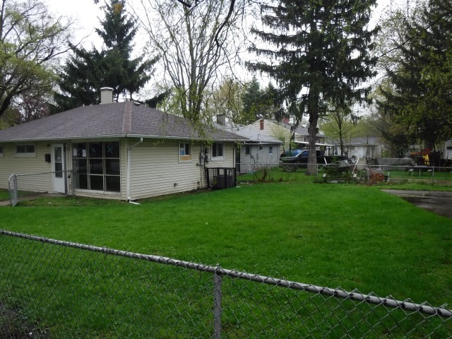 1131 146th Street Dolton, IL 60419 - Photo 3 of 15 a view of a house with a backyard