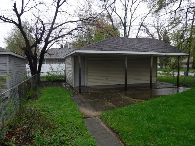 1131 146th Street Dolton, IL 60419 - Photo 5 of 15 a view of a house with a yard