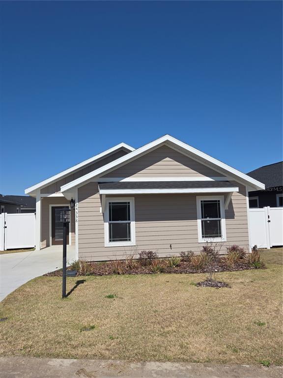 24338 Southwest 18th Road Newberry, FL 32669 - Photo 3 of 20 a front view of a house with garage