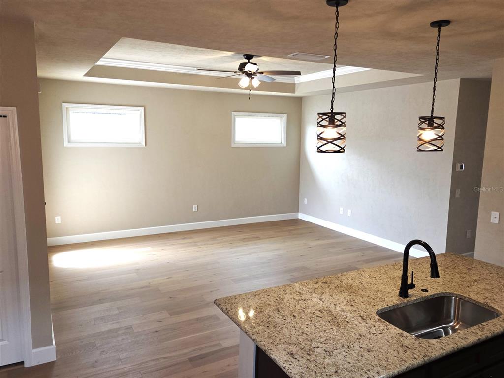 24338 Southwest 18th Road Newberry, FL 32669 - Photo 8 of 20 a kitchen with a sink a counter space and a window