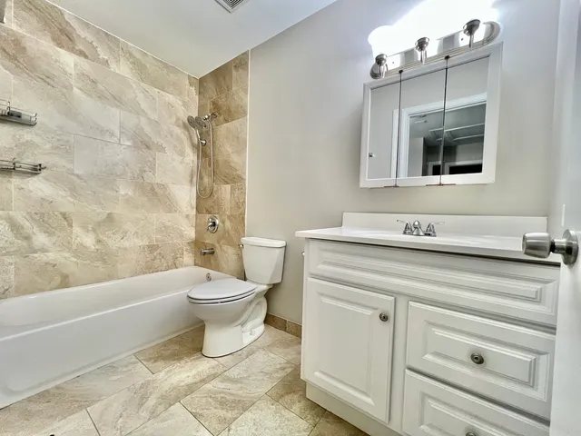 a bathroom with a sink a toilet and a bathtub