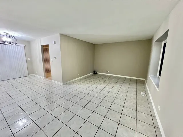 a view of an empty room and window