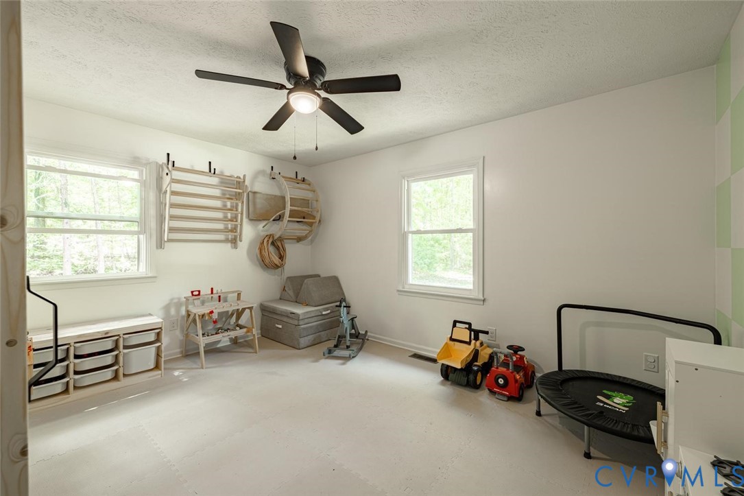 12397 New Market Mill Road Beaverdam, VA 23015 - Photo 23 of 44 a bedroom with furniture and a window