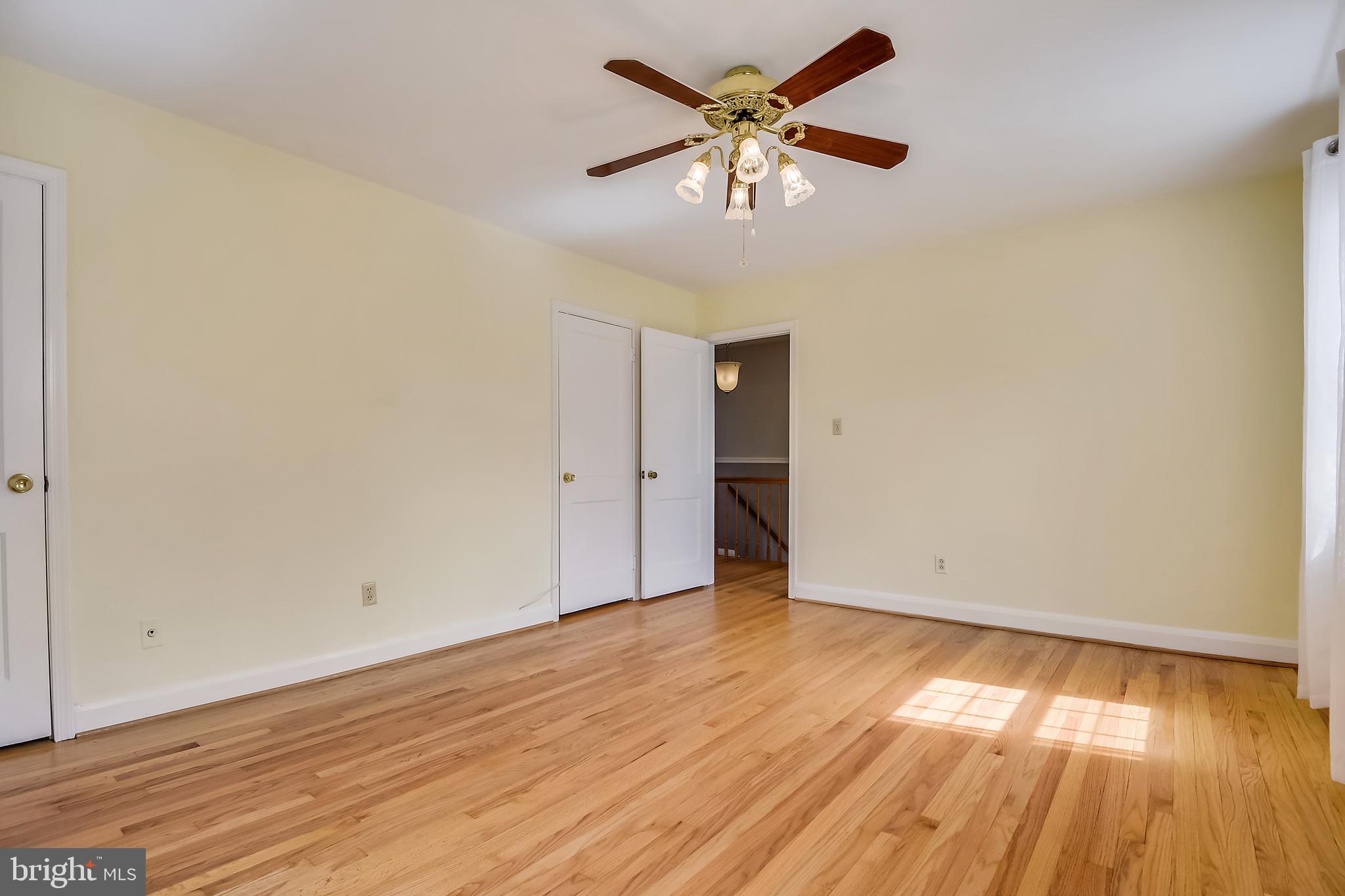 1622 Myamby Road Baltimore, MD 21286 - Photo 11 of 28 an empty room with wooden floor and windows
