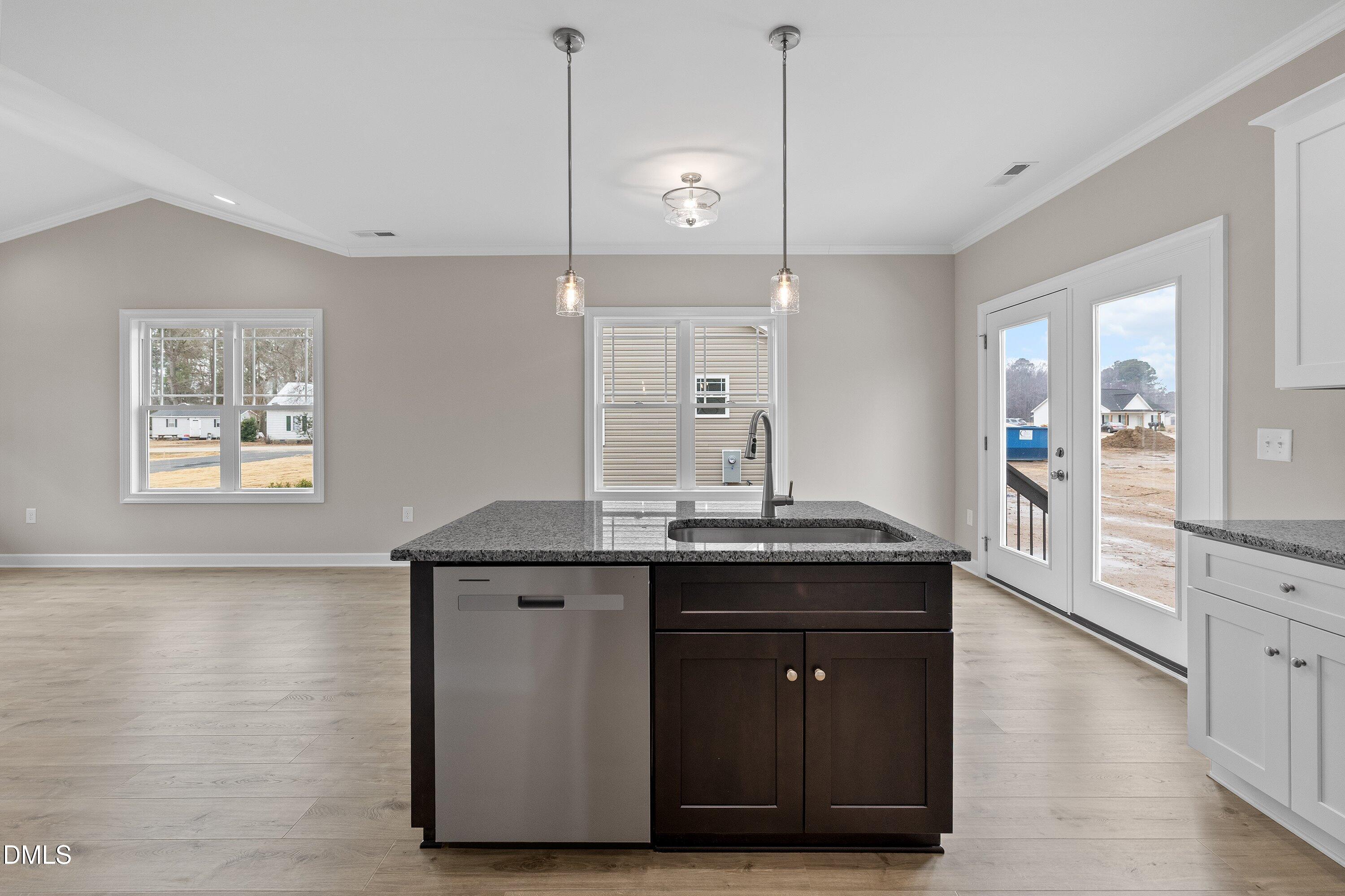 926 Micro Road West Selma, NC 27576 - Photo 25 of 41 a kitchen with a sink and cabinets