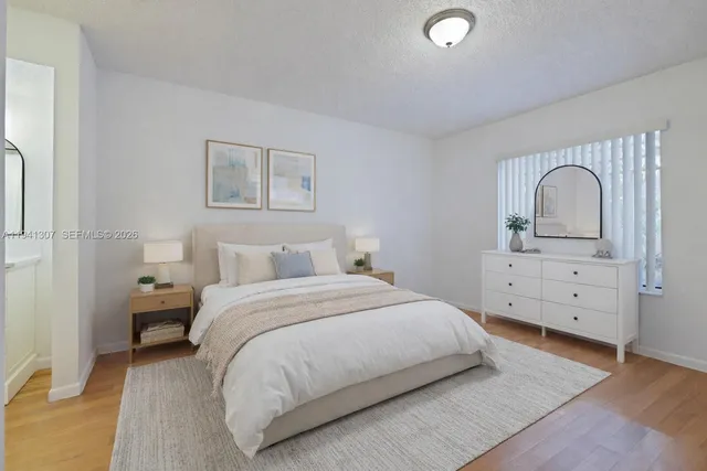 a bedroom with a bed and a dresser