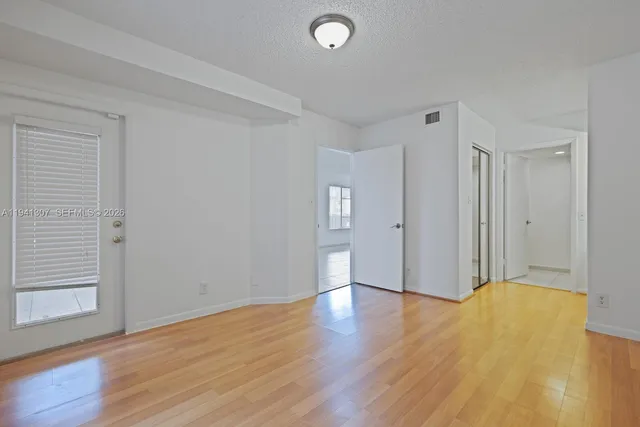a view of a livingroom with wooden floor