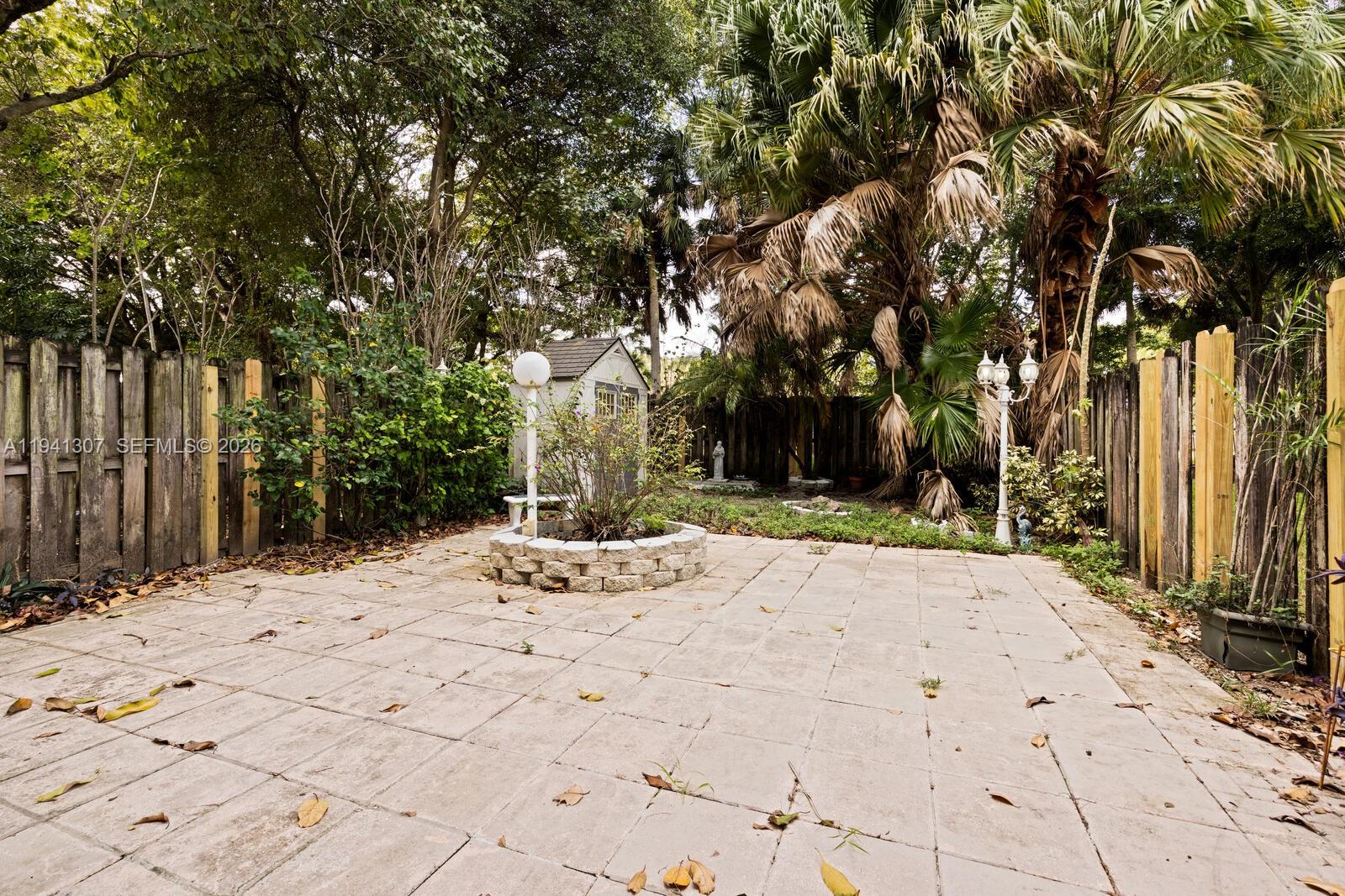 9500 Southwest 140th Court, Unit 9500 Miami, FL 33186 - Photo 20 of 21 a view of a backyard of the house