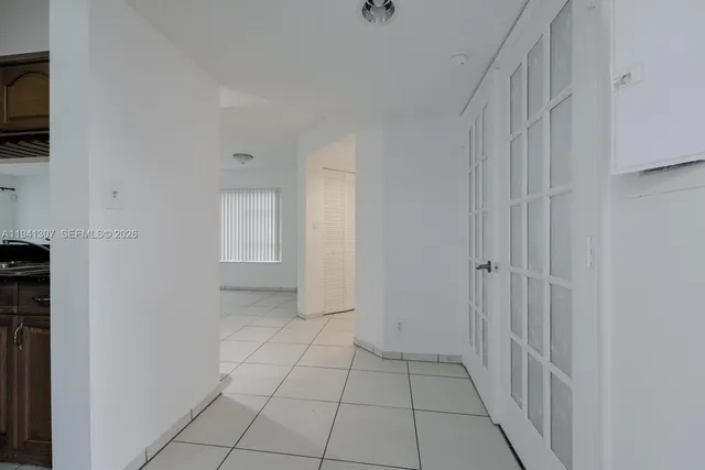 a view of an empty room and fire place