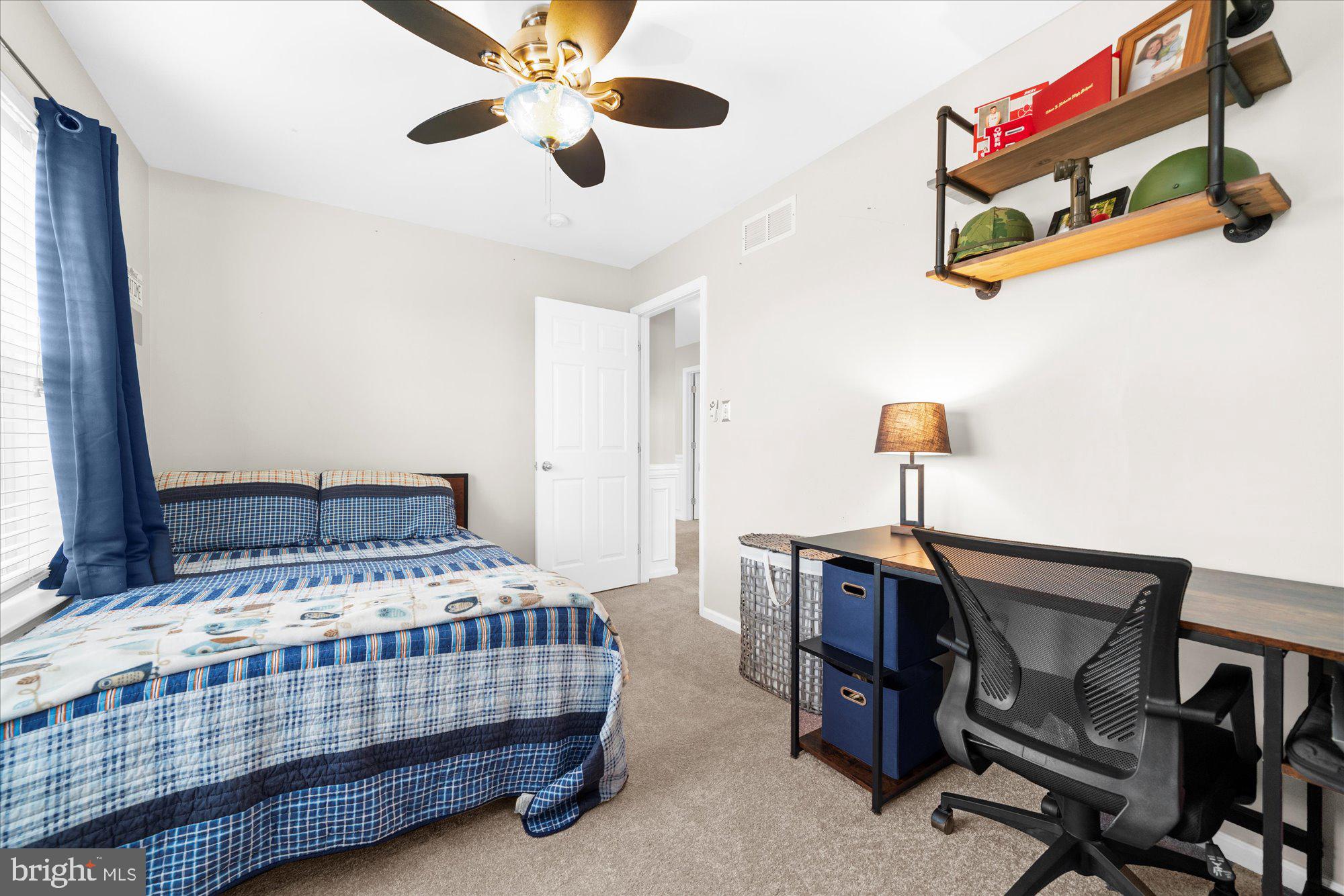 621 Hoffman Boulevard Spring City, PA 19475 - Photo 32 of 45 a bedroom with a bed and a chandelier