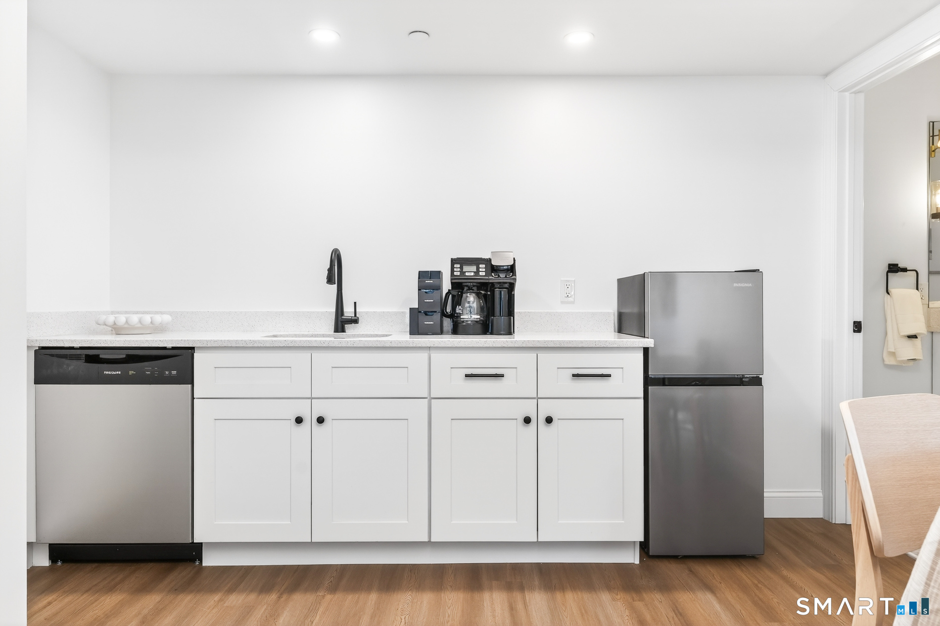 44 Williams Avenue Stonington, CT 06355 - Photo 14 of 39 a kitchen with stainless steel appliances white cabinets and a refrigerator