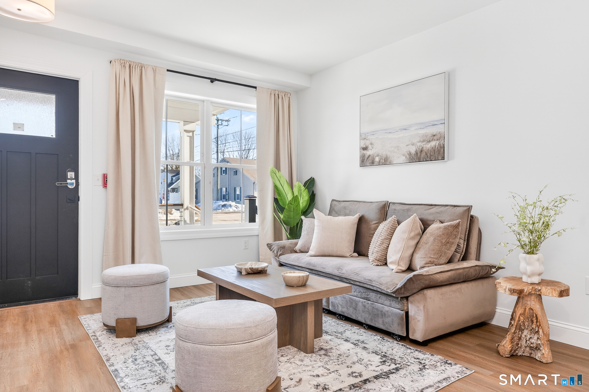 44 Williams Avenue Stonington, CT 06355 - Photo 15 of 39 a living room with furniture and a large window