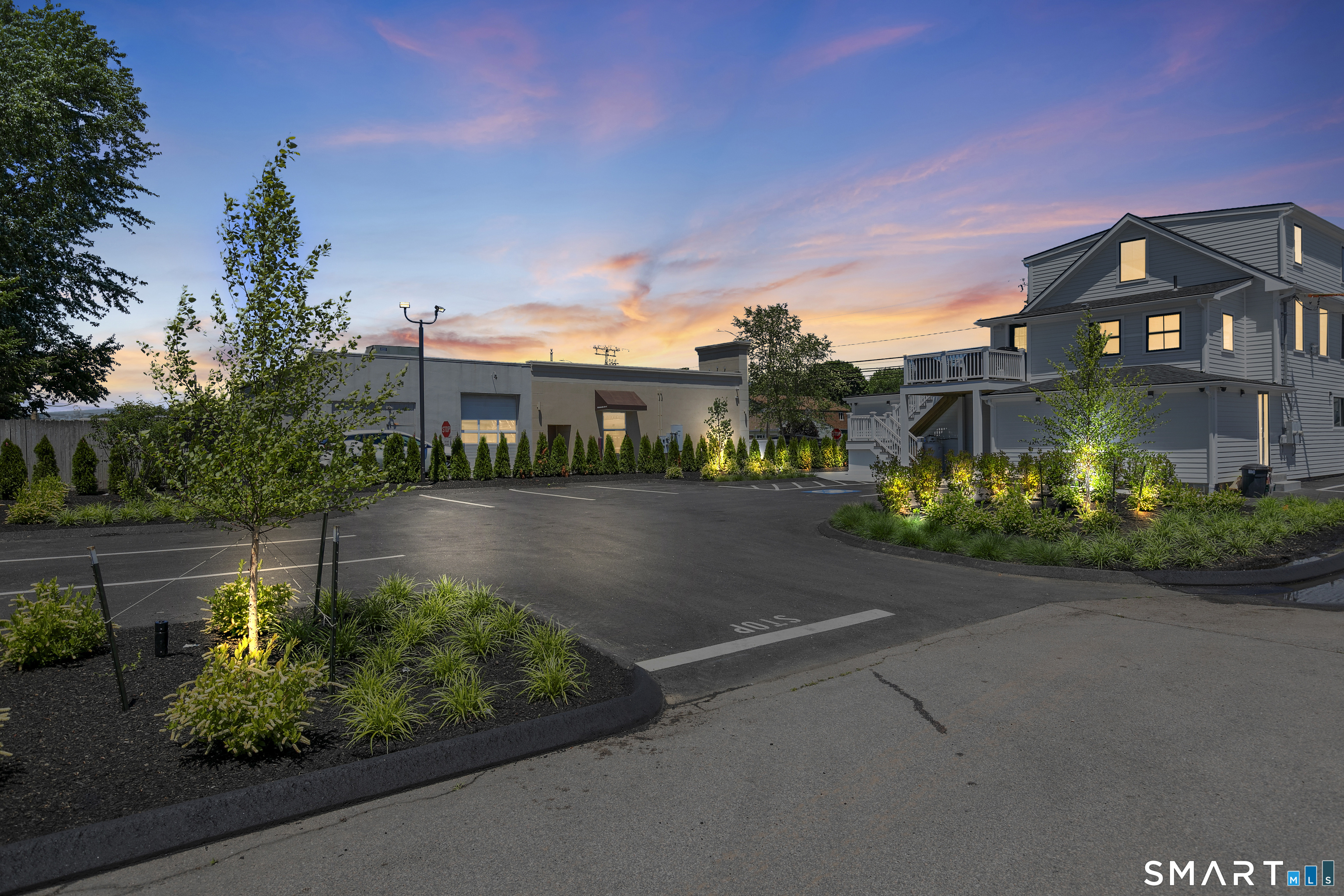 44 Williams Avenue Stonington, CT 06355 - Photo 2 of 39 a front view of a house with a garden and plants