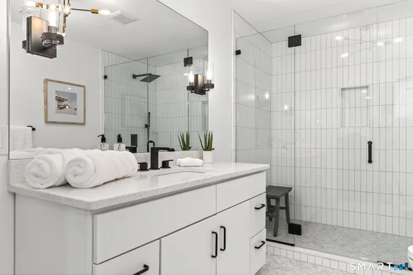 a bathroom with a sink and mirror