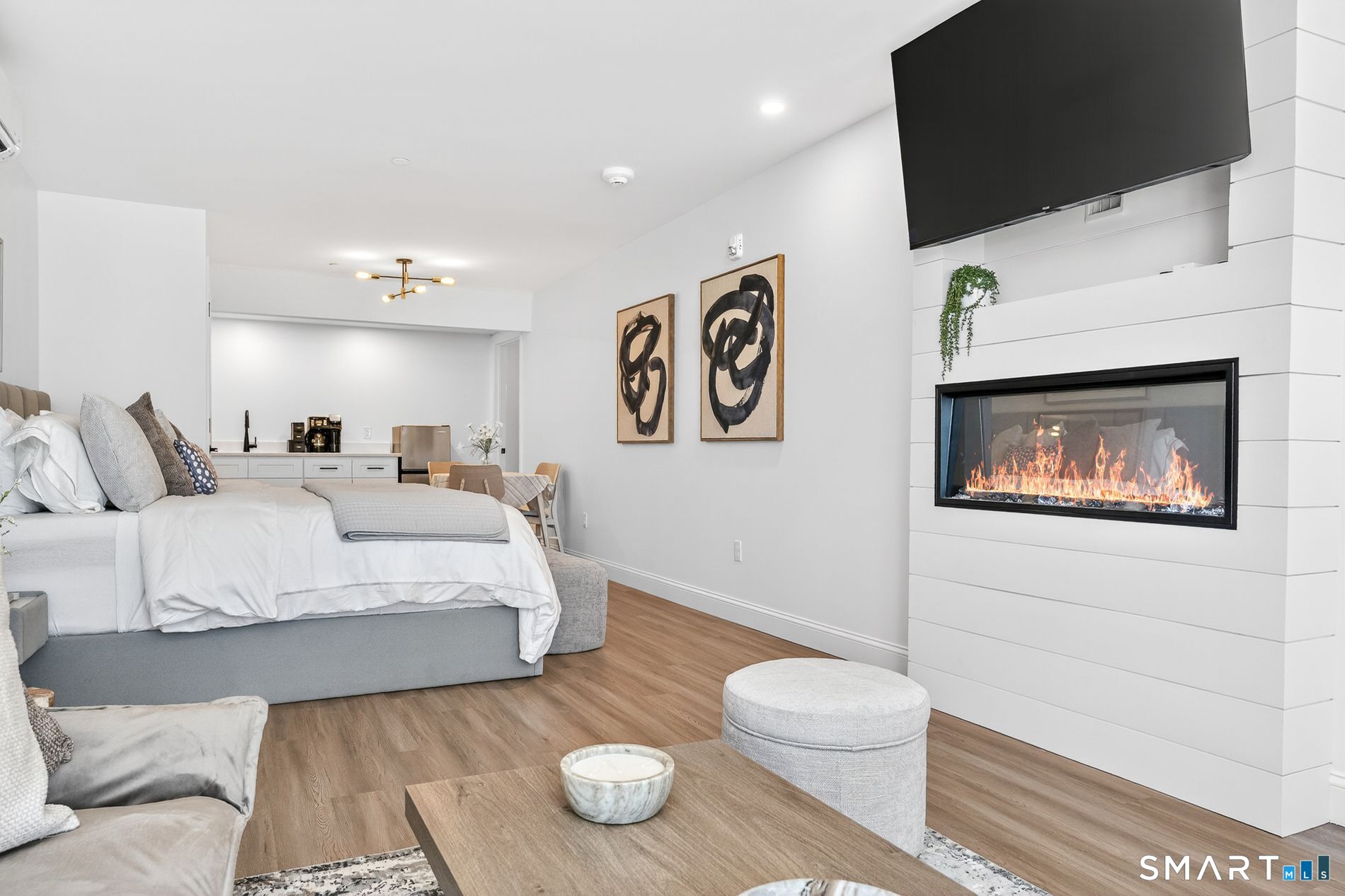 44 Williams Avenue Stonington, CT 06355 - Photo 33 of 39 a spacious bedroom with a bed and a flat screen tv