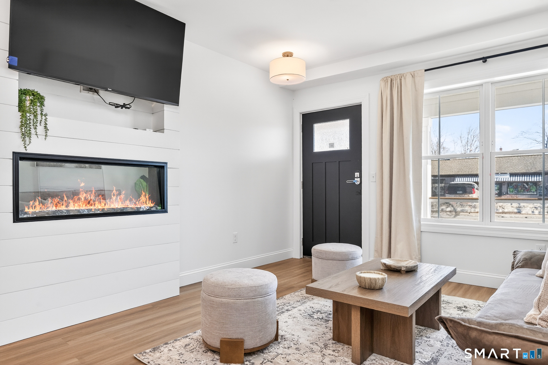 44 Williams Avenue Stonington, CT 06355 - Photo 34 of 39 a living room with furniture and a flat screen tv