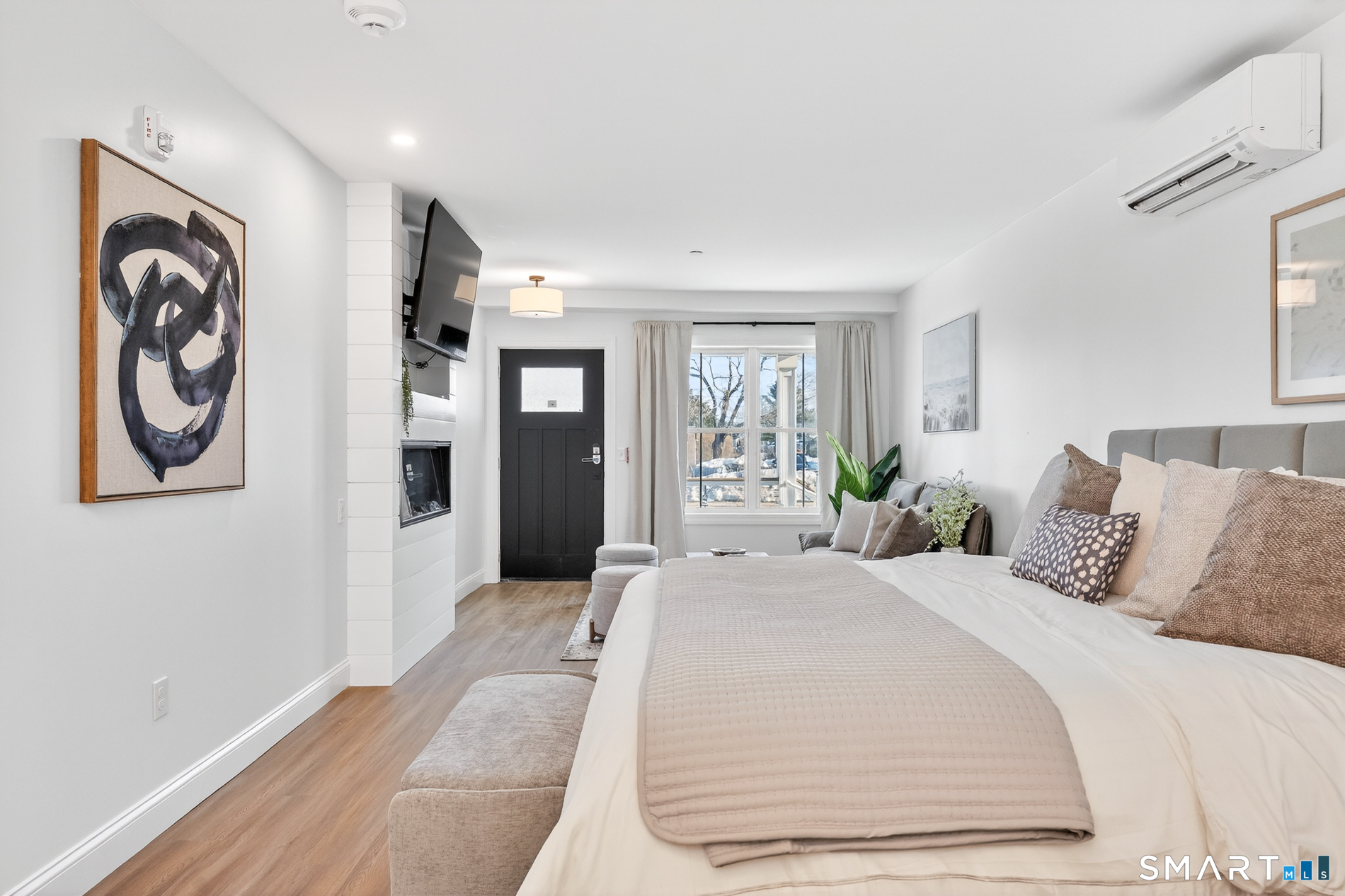 44 Williams Avenue Stonington, CT 06355 - Photo 36 of 39 a bedroom with a bed and glass windows