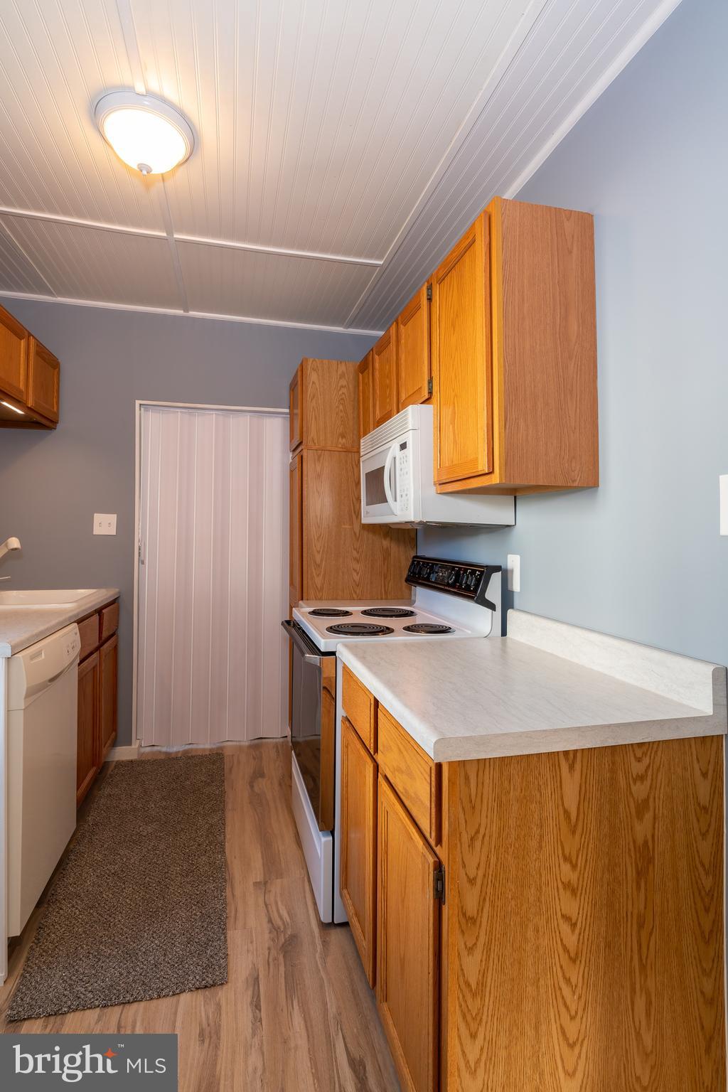 1230 Reading Road Denver, PA 17517 - Photo 14 of 36 a kitchen with a sink a stove top oven and cabinetry