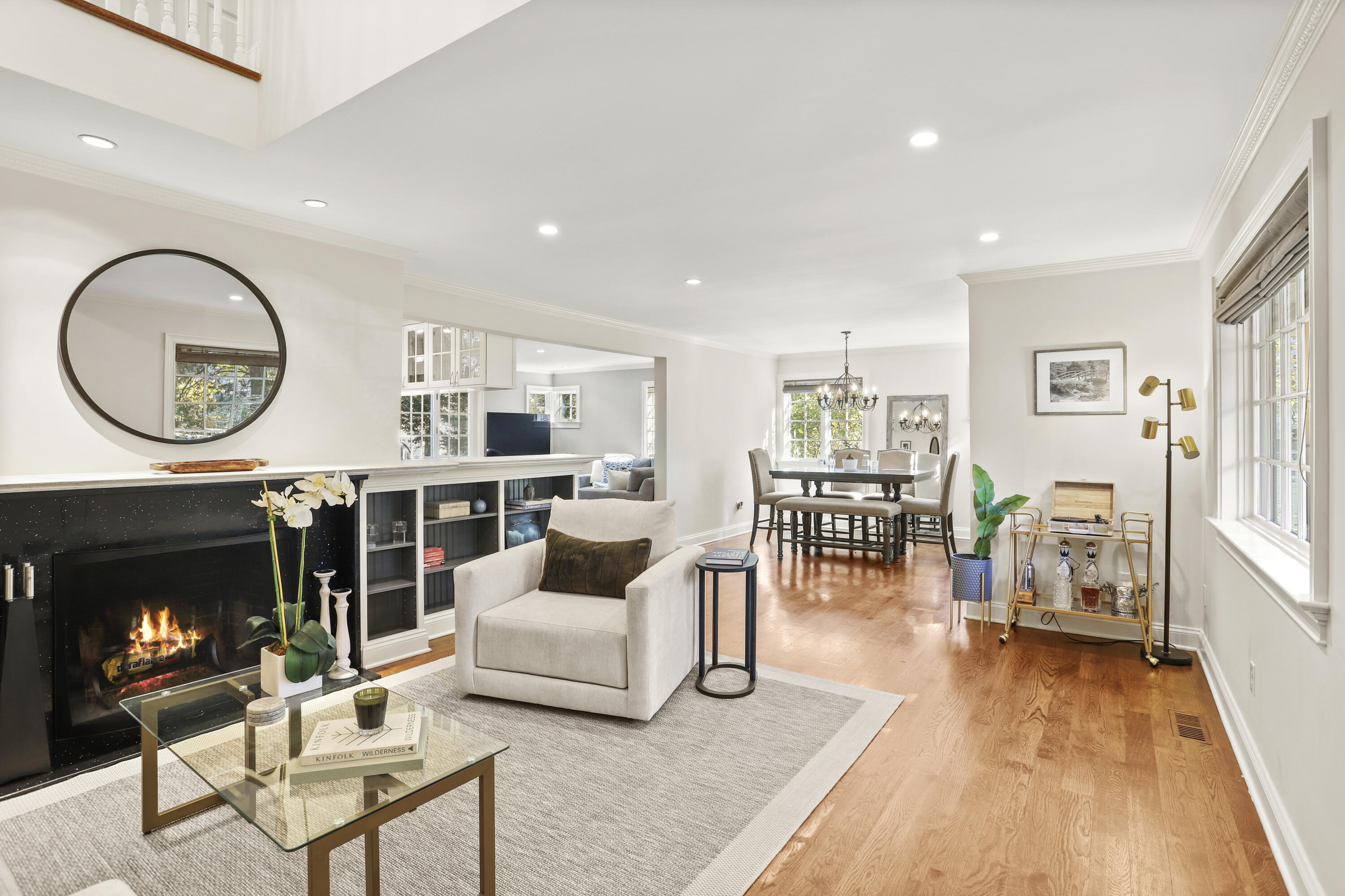 5 Laforge Road Darien, CT 06820 - Photo 3 of 24 a living room with furniture a fireplace a rug and a large window