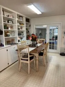 a dining room with furniture and window