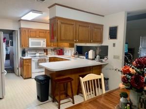 2232 Private Road 4032 Road Eden, TX 76837 - Photo 19 of 40 a kitchen with a sink refrigerator and cabinets