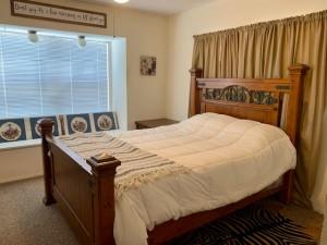 2232 Private Road 4032 Road Eden, TX 76837 - Photo 20 of 40 a bed sitting in a bedroom next to a bathroom