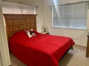 a bed sitting in a bedroom next to a window