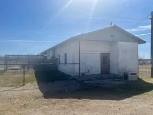 a view of a back yard of the house