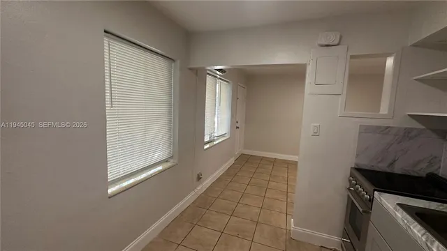 a bathroom with a sink mirror and toilet