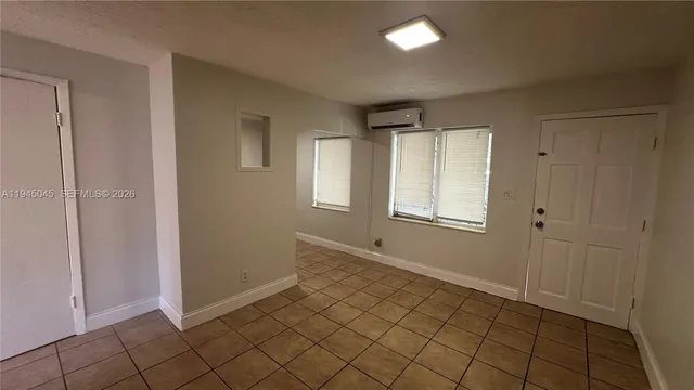 a view of an empty room with a window