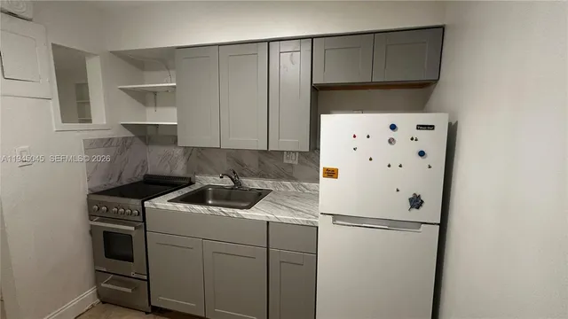 a view of a livingroom with an empty space and window