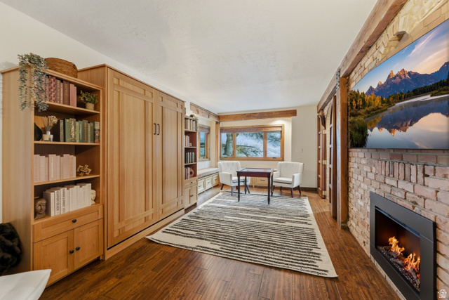 2687 Stewart Road Sundance, UT 84604 - Photo 14 of 48 Office space with a brick fireplace and dark wood-type flooring
