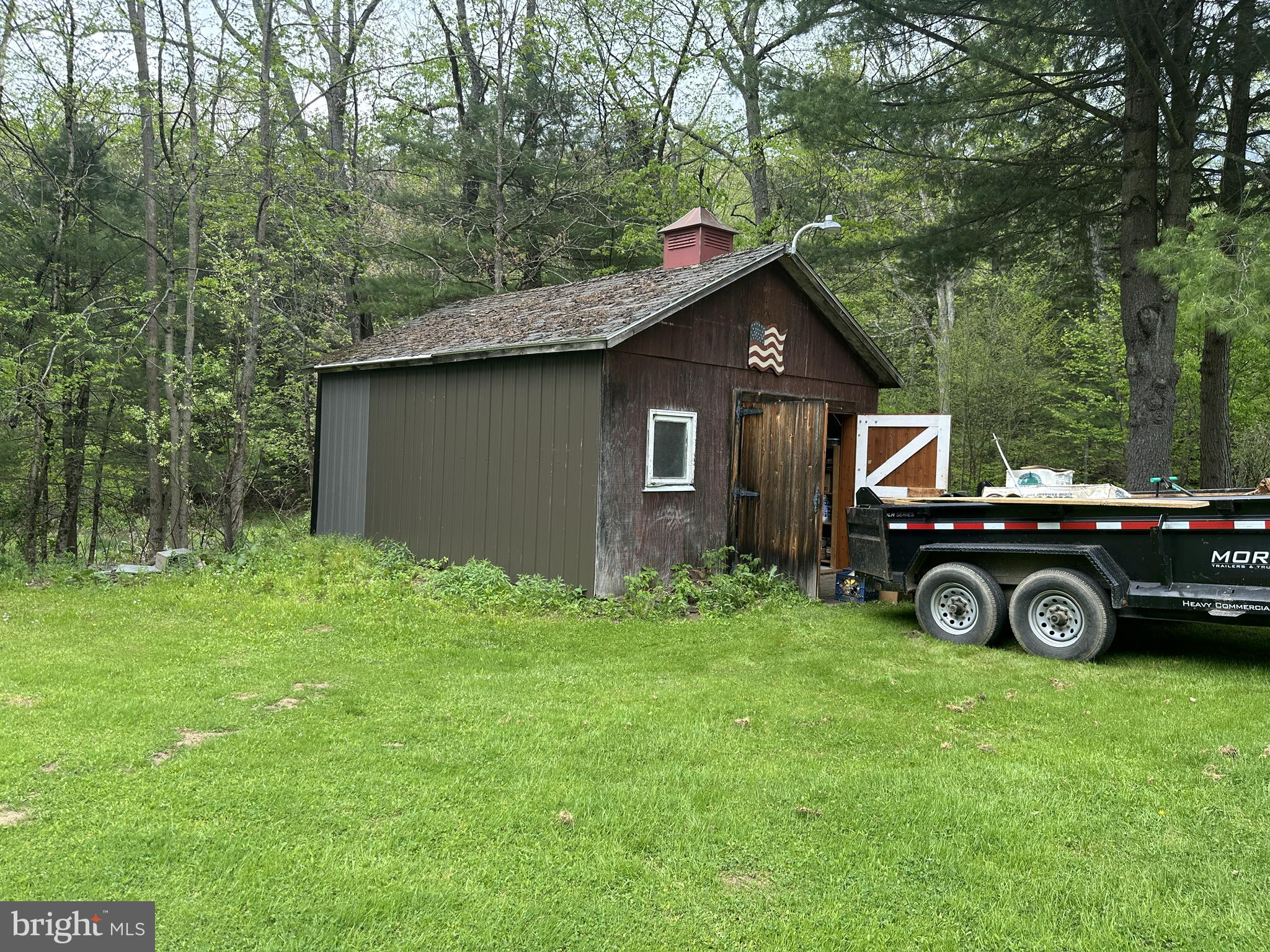 111 Rob Roy Road Bradford, PA 16701 - Photo 24 of 41 Charming shed nestled in lush greenery.